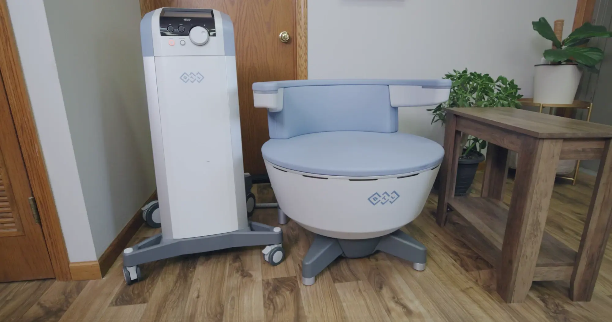 The EMSELLA chair and its console in the treatment room at Candescent Health & Wellness